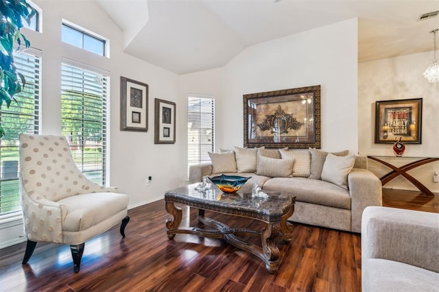 1721 Park View Pl, Edmond, OK 73003 - living room featuring a chandelier, dark wood-style flooring, vaulted ceiling, and baseboards