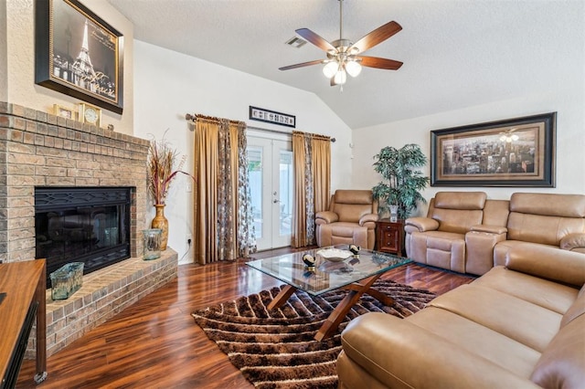 1721 Park View Pl, Edmond, OK 73003 - living room with vaulted ceiling, wood finished floors, ceiling fan, and a brick fireplace