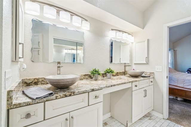 1721 Park View Pl, Edmond, OK 73003 - full bath with ensuite bathroom, double vanity, and baseboards