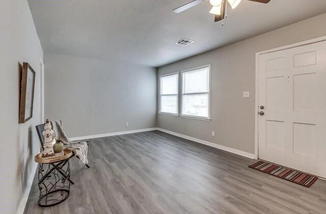4017 Mallard Dr, Oklahoma City, OK 73115 - foyer entrance with a ceiling fan, wood finished floors, and baseboards