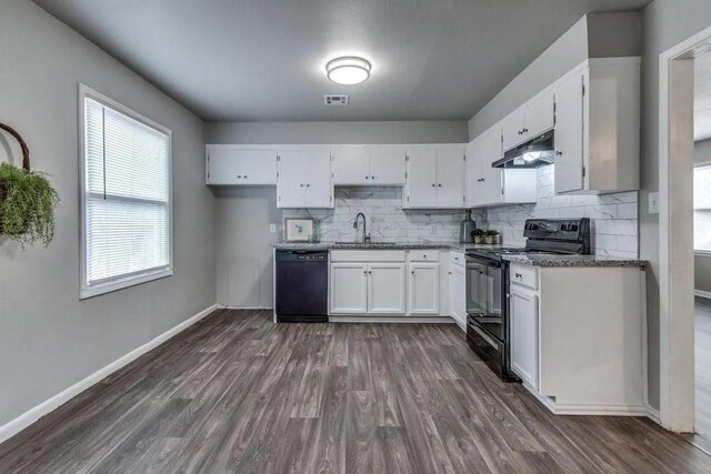 4017 Mallard Dr, Oklahoma City, OK 73115 - kitchen with black appliances, a sink, white cabinetry, and decorative backsplash
