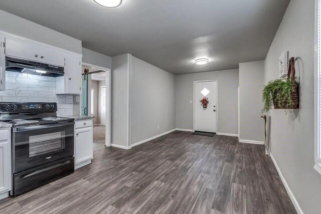 4017 Mallard Dr, Oklahoma City, OK 73115 - foyer entrance featuring dark wood-style floors and baseboards