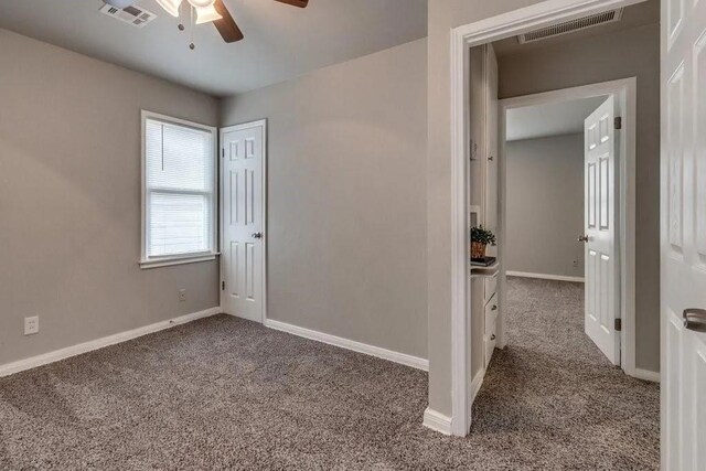 4017 Mallard Dr, Oklahoma City, OK 73115 - spare room featuring carpet flooring, ceiling fan, and baseboards