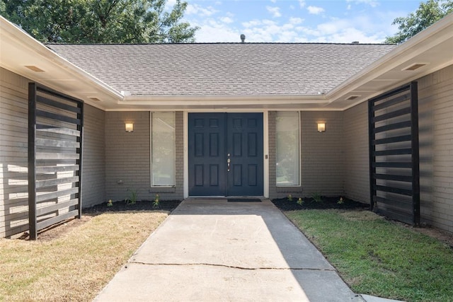 3004 Robin Ridge Rd, Oklahoma City, OK 73120 - view of exterior entry featuring a shingled roof and a lawn
