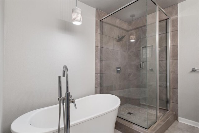 3004 Robin Ridge Rd, Oklahoma City, OK 73120 - full bath with a shower stall, a soaking tub, and baseboards