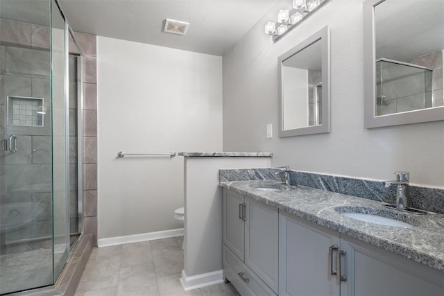 3004 Robin Ridge Rd, Oklahoma City, OK 73120 - bathroom featuring a stall shower, toilet, double vanity, and baseboards