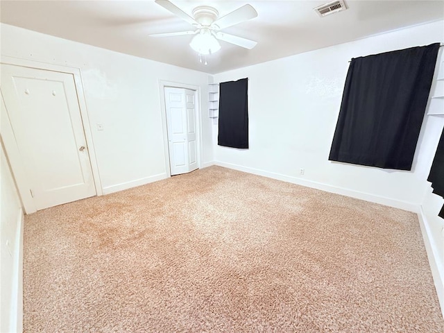 1710 W Chickasha Ave, Chickasha, OK 73018 - unfurnished bedroom with carpet floors, a closet, ceiling fan, and baseboards