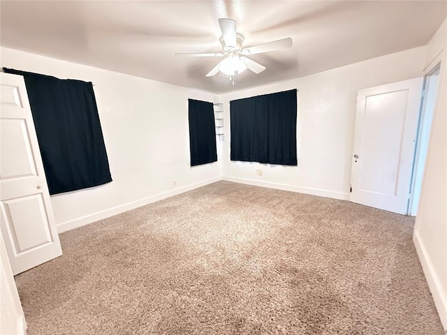 1710 W Chickasha Ave, Chickasha, OK 73018 - unfurnished room featuring carpet flooring, a ceiling fan, and baseboards