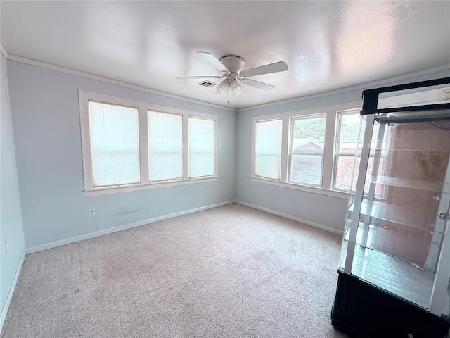 1710 W Chickasha Ave, Chickasha, OK 73018 - carpeted empty room featuring a ceiling fan, baseboards, and crown molding