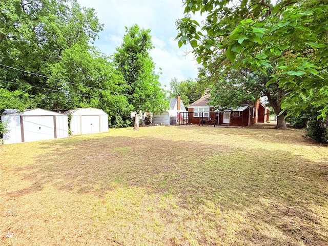 1710 W Chickasha Ave, Chickasha, OK 73018 - view of grassy yard with a shed, an outbuilding, and a detached garage