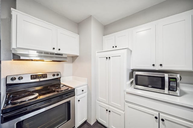 kitchen with stainless steel appliances, under cabinet range hood, light countertops, and white cabinetry
