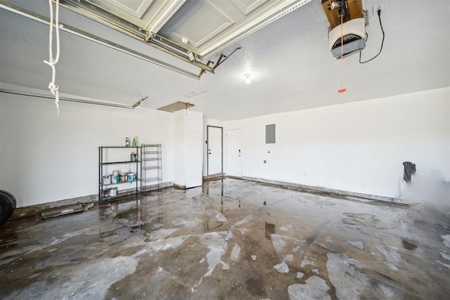garage featuring a garage door opener and electric panel