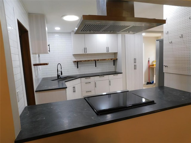5737 NW 31st St, Oklahoma City, OK 73122 - kitchen featuring ventilation hood, a sink, stovetop, dark countertops, and white cabinetry