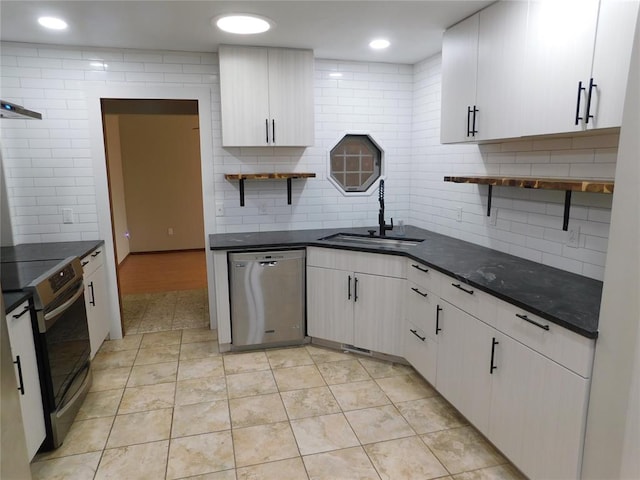 5737 NW 31st St, Oklahoma City, OK 73122 - kitchen with open shelves, stainless steel appliances, a sink, tasteful backsplash, and light tile patterned flooring