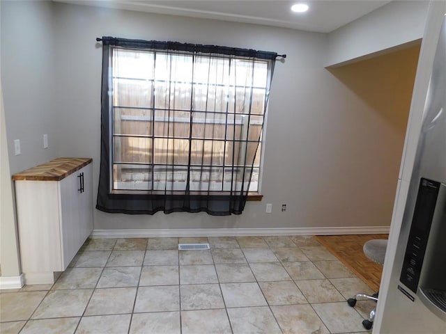 5737 NW 31st St, Oklahoma City, OK 73122 - unfurnished dining area with healthy amount of natural light, baseboards, and recessed lighting