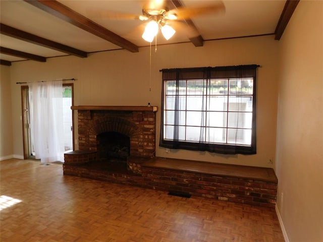 5737 NW 31st St, Oklahoma City, OK 73122 - unfurnished living room with beamed ceiling, baseboards, ceiling fan, and a fireplace