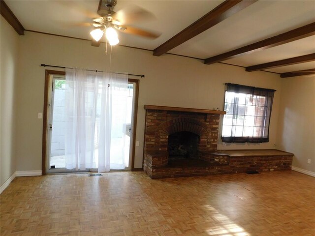 5737 NW 31st St, Oklahoma City, OK 73122 - unfurnished living room with baseboards, ceiling fan, healthy amount of natural light, beamed ceiling, and a fireplace
