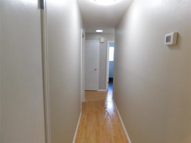 5737 NW 31st St, Oklahoma City, OK 73122 - hallway featuring light wood-style flooring and baseboards