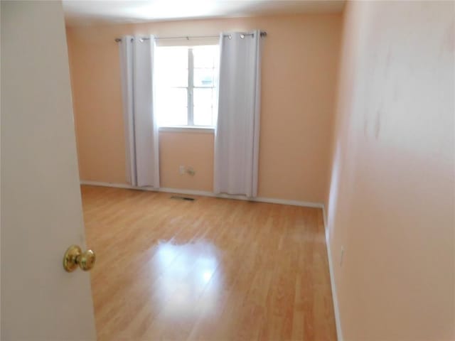 5737 NW 31st St, Oklahoma City, OK 73122 - empty room with wood finished floors and baseboards