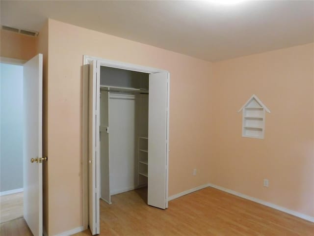 5737 NW 31st St, Oklahoma City, OK 73122 - unfurnished bedroom featuring light wood finished floors, baseboards, and a closet