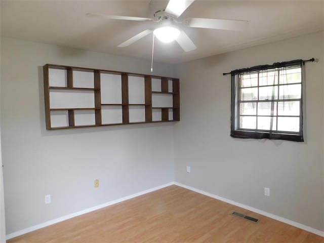 5737 NW 31st St, Oklahoma City, OK 73122 - spare room featuring a ceiling fan, light wood-style floors, and baseboards