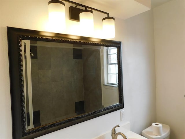 5737 NW 31st St, Oklahoma City, OK 73122 - bathroom featuring a shower stall, toilet, and a sink