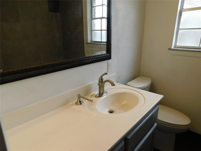 5737 NW 31st St, Oklahoma City, OK 73122 - bathroom featuring toilet, healthy amount of natural light, and vanity