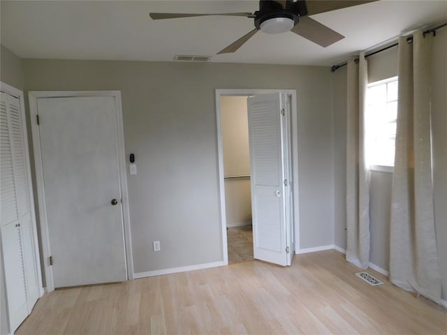 5737 NW 31st St, Oklahoma City, OK 73122 - unfurnished bedroom with light wood-style floors, baseboards, and a ceiling fan