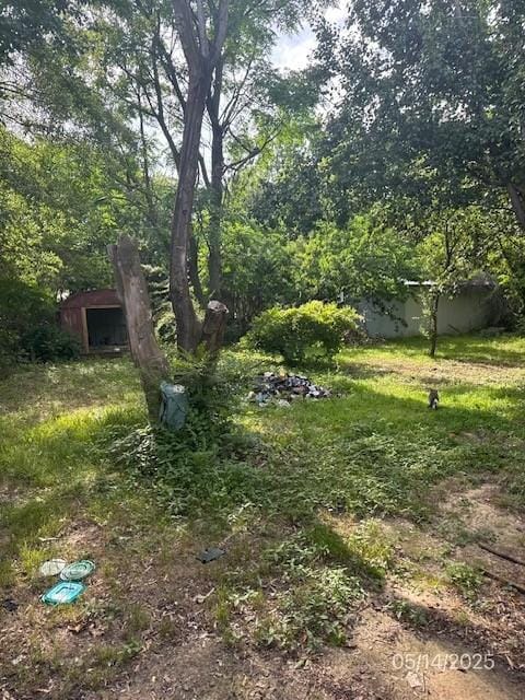 109 Burke St, Broken Bow, OK 74728 - view of yard with an outbuilding