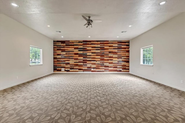 1126 SW 19th St, Oklahoma City, OK 73108 - empty room with carpet flooring, healthy amount of natural light, a ceiling fan, recessed lighting, and baseboards