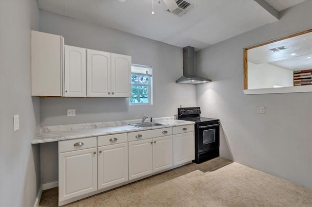 1126 SW 19th St, Oklahoma City, OK 73108 - kitchen with electric range, wall chimney range hood, light countertops, white cabinetry, and a sink
