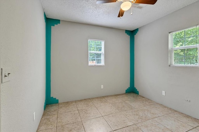 1126 SW 19th St, Oklahoma City, OK 73108 - spare room featuring a ceiling fan, a textured ceiling, and light tile patterned flooring