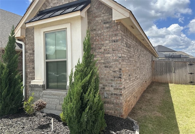 14709 Chambord Dr, Yukon, OK 73099 - view of home's exterior with brick siding and stucco siding