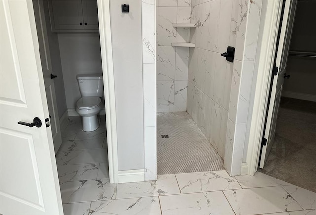 14709 Chambord Dr, Yukon, OK 73099 - bathroom featuring marble look tile flooring, a tile shower, and toilet