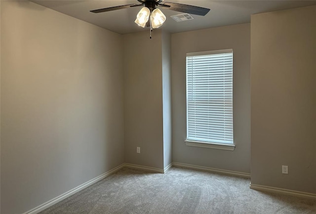 14709 Chambord Dr, Yukon, OK 73099 - carpeted spare room featuring a ceiling fan, baseboards, and plenty of natural light