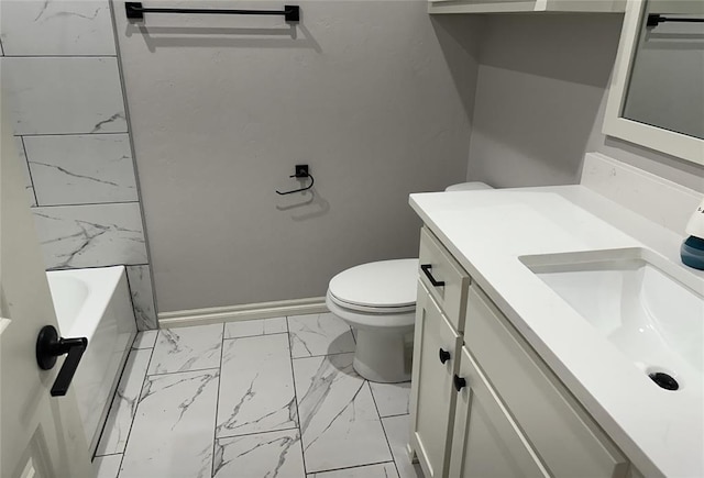 14709 Chambord Dr, Yukon, OK 73099 - full bathroom featuring marble finish floors, toilet, vanity, a tub, and baseboards