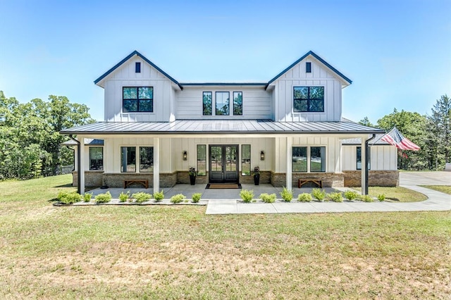 6301 144th Ave NE, Newalla, OK 74857 - modern farmhouse style home featuring a standing seam roof, french doors, and metal roof