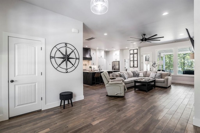 6301 144th Ave NE, Newalla, OK 74857 - living room with dark wood-style flooring, ceiling fan, baseboards, and recessed lighting