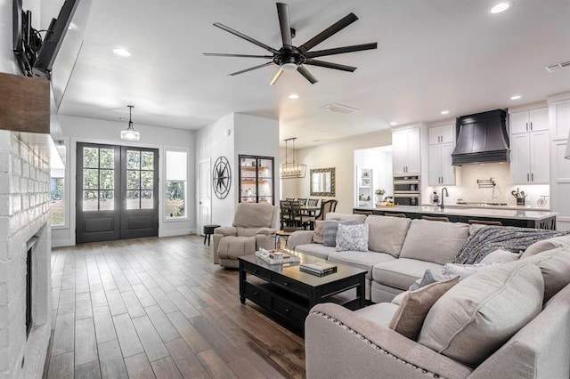 6301 144th Ave NE, Newalla, OK 74857 - living room featuring a ceiling fan, recessed lighting, dark wood-type flooring, and french doors