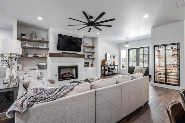 6301 144th Ave NE, Newalla, OK 74857 - living area with dark wood finished floors, a large fireplace, ceiling fan, and recessed lighting