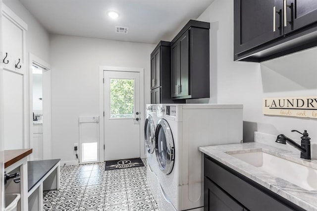 6301 144th Ave NE, Newalla, OK 74857 - laundry room featuring cabinet space, washing machine and clothes dryer, and light tile patterned floors
