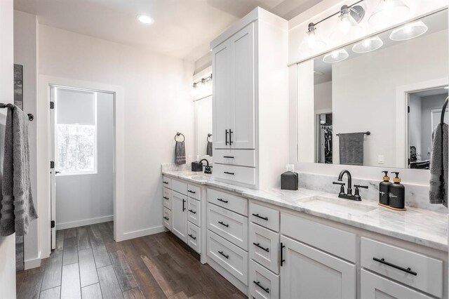 6301 144th Ave NE, Newalla, OK 74857 - full bath with double vanity, wood finished floors, baseboards, and recessed lighting