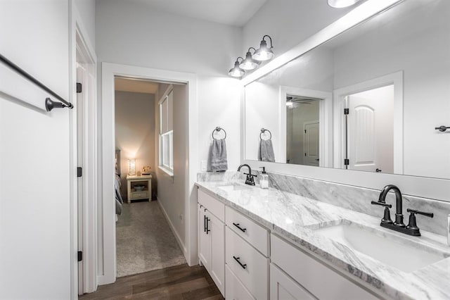 6301 144th Ave NE, Newalla, OK 74857 - full bath with wood finished floors, ceiling fan, double vanity, ensuite bathroom, and baseboards