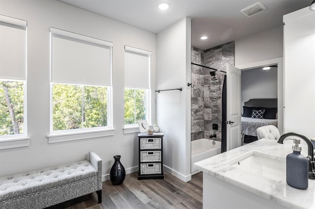 6301 144th Ave NE, Newalla, OK 74857 - bathroom with wood finished floors, shower / washtub combination, recessed lighting, baseboards, and ensuite bathroom