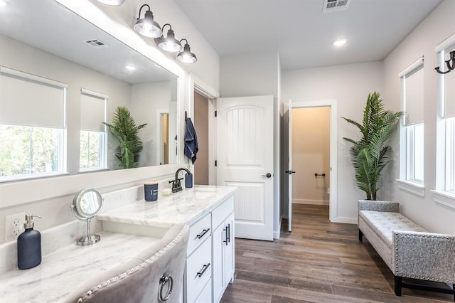 6301 144th Ave NE, Newalla, OK 74857 - full bath featuring wood finished floors, plenty of natural light, vanity, recessed lighting, and baseboards