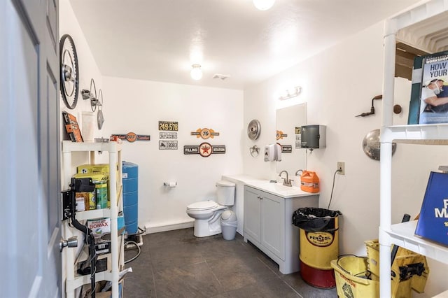 6301 144th Ave NE, Newalla, OK 74857 - bathroom featuring toilet, vanity, and baseboards