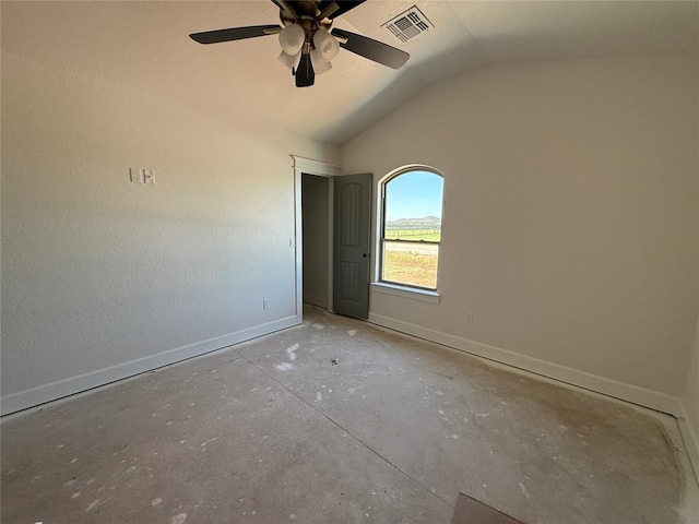 5 Old Glory Ave, Altus, OK 73521 - spare room featuring lofted ceiling, a ceiling fan, baseboards, and concrete floors