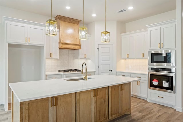 3000 Road Runner Ct, Guthrie, OK 73044 - kitchen with stainless steel appliances, a sink, white cabinetry, tasteful backsplash, and recessed lighting
