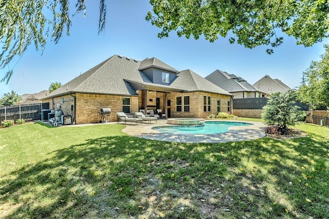 19633 Stratmore Way, Edmond, OK 73012 - back of property with a pool with connected hot tub, brick siding, a patio, outdoor lounge area, and central AC