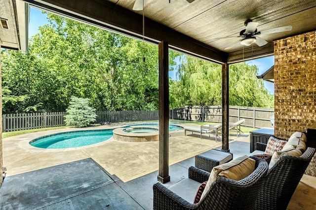19633 Stratmore Way, Edmond, OK 73012 - fenced backyard with ceiling fan, a patio area, an in-ground hot tub, and view of wooded area